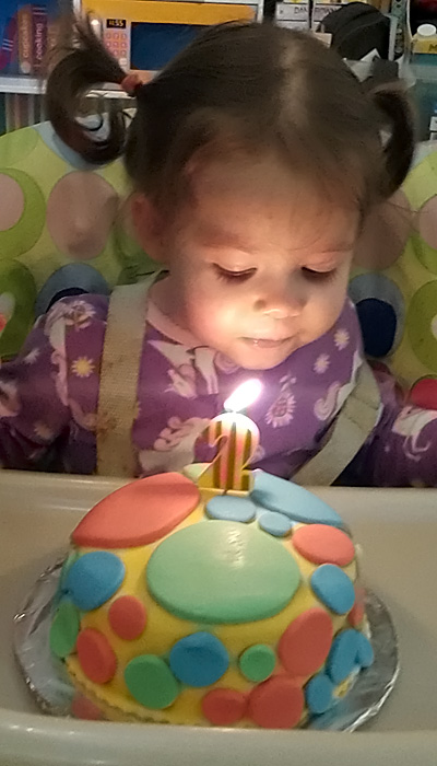 Turning two - blowing out the candles - Mr Tumble's spotty birthday cake